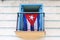 Cuban flag displayed in the colonial stylish window