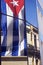 Cuban flag and modern and old facades