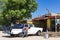 Cuban man wash his american black white 1957 Ford Fairlane classic car in Varadero Cuba -