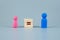 Cube block of equal sign between Pink Women and Blue Men wooden symbol. gender equality concept