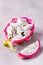 Cube of Dragon Fruit Served in Half a Dragon Fruit on Gray Background Tasty Tropical Fruit Pitaya Vertical