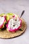 Cube of Dragon Fruit Served in Half a Dragon Fruit on Straw Napkin Gray Background Tasty Tropical Fruit Pitaya