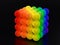 Cube formed from glowing rainbow color balls