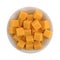 Cubed mild cheddar cheese in a white bowl