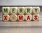 Cubes, blocks or dice with merry x-mas christmas on wooden background