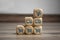 Cubes, blocks or Dice with online shopping symbols on wooden background