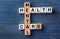 Cubes composed words MENTAL HEALTH CARE on color wooden table