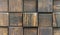 Cubes from of dark aged wood. Panel with wooden squares for wall decor