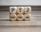 Cubes or dice with acronym PTJ for Part Time Job on wooden background