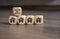 Cubes dice with the german words for buy or rent - kaufen oder mietenand house icons