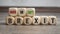 Cubes or dice with hard or soft brexit on wooden background