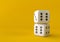 Cubes dice two white dices on yellow background