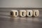 Cubes and dice with words heal and real on wooden background