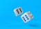 Cubes dices on blue background in pastel colors