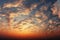 Cubic clouds panorama sunset sky in stunning orange hues