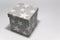 Cubic gray cardboard box decorated with white stars. Craft box