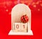 Cubic wooden calendar with the date January 1 and decoration on a red background. The concept of a happy New year