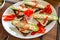 Cucumber boat with fresh quark, pepper strips on black bread