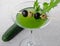 Cucumber cocktail on a sand background