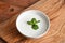 Cucumber And Mint yogurt raita served in dish isolated on wooden table top view middle eastern appetizers food