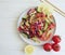 Cucumber salad tomatoes health vegan appetizer lemon wand on a wooden background