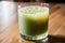 Cucumber smoothie in a glass on a black background. Green smoothie with lime and mint. Healthy food concept. Generative AI