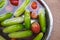 Cucumber and Tomato in water on a bowl Steel