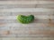 Cucumber on a wooden surface. Fresh cucumber on a cutting board. Cucumber for salads, appetizers, fried foods, soup and stews.