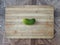 Cucumber on a wooden surface. Fresh cucumber on a cutting board. Cucumber for salads, appetizers, fried foods, soup and stews.