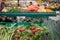 Cucumbers, eggplants, radish and spring onions on the fruits and vegetables aisle in a store