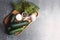 Cucumbers, fennel pepper, a bowl of salt and garlic on white background flat lay - home canning concept