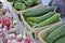 Cucumbers and radishes displayed for sale