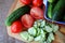 Cucumbers and tomatoes lying on the board