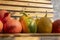 Cucurbita pepo and cucurbita maxima on wooden bench, ripened vegetables, autumn harvest