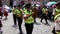 Cuenca, Ecuador - 20160206 - Police Band Marches in Parade Followed by Man on Stilts.