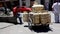 Cuenca, Ecuador - 20180920 - Man Sits on Stoop Next to His Cart Filled With Propane Tanks.