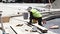 Cuenca, Ecuador - 20180920 - Worker Pounds Nails For Park Reconstruction Project.