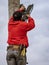 Cuenca, Ecuador - 2019-12-31 - Workman attaches LED lgiht to pole for festival