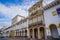 Cuenca, Ecuador - April 22, 2015: Beautiful spanish colonial townhouses with decorated facades, traditional Cuenca architecture an