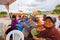 Cuenca, Ecuador - April 22, 2015: Local old people enjoying a musical performance on city square, ladies clapping and smiling