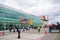 Cuenca, Ecuador - April 22, 2015: Passengers entering airport terminal building from runway area, red cones and markings on