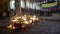 Cuenca, Ecuador - December 31, 2018 - People watch street bonfire at midnight on New Years Eve with Ecuadorian Flag in background