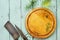 Culinary background. Ancient meat knife above the cutting board, various spices and rosemary.