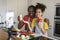 Culinary Blog. Happy Black Man And His Daughter Recording Video In Kitchen