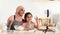 Culinary Blog. Happy Muslim Woman And Little Daughter Recording Video In Kitchen