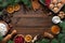 Culinary Christmas background. Ingredients for homemade New Year`s baking on a wooden background