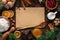 Culinary Christmas background. Ingredients for homemade New Year`s baking on a wooden background and a sheet of paper in the