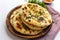 Culinary delight Naan, an isolated serving of delectable Indian bread