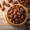 Culinary elegance Dates in a bowl on wooden backdrop