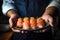 Culinary expertise: chef\\\'s hands with sushi delicacies